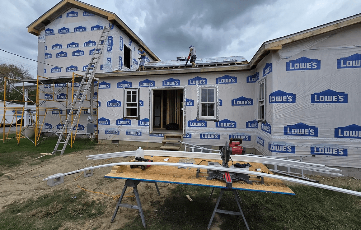 Construction site with tools and ladder